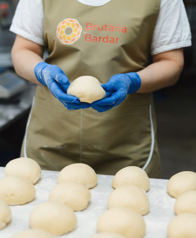 Baker shaping dough